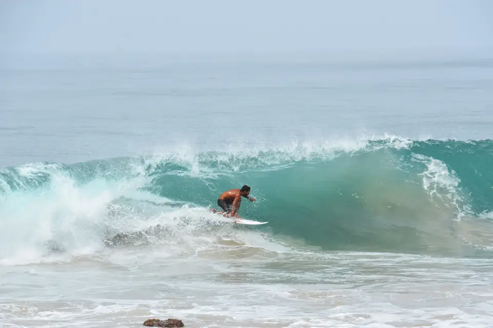 A surf lesson in the whitewash at Edava beach