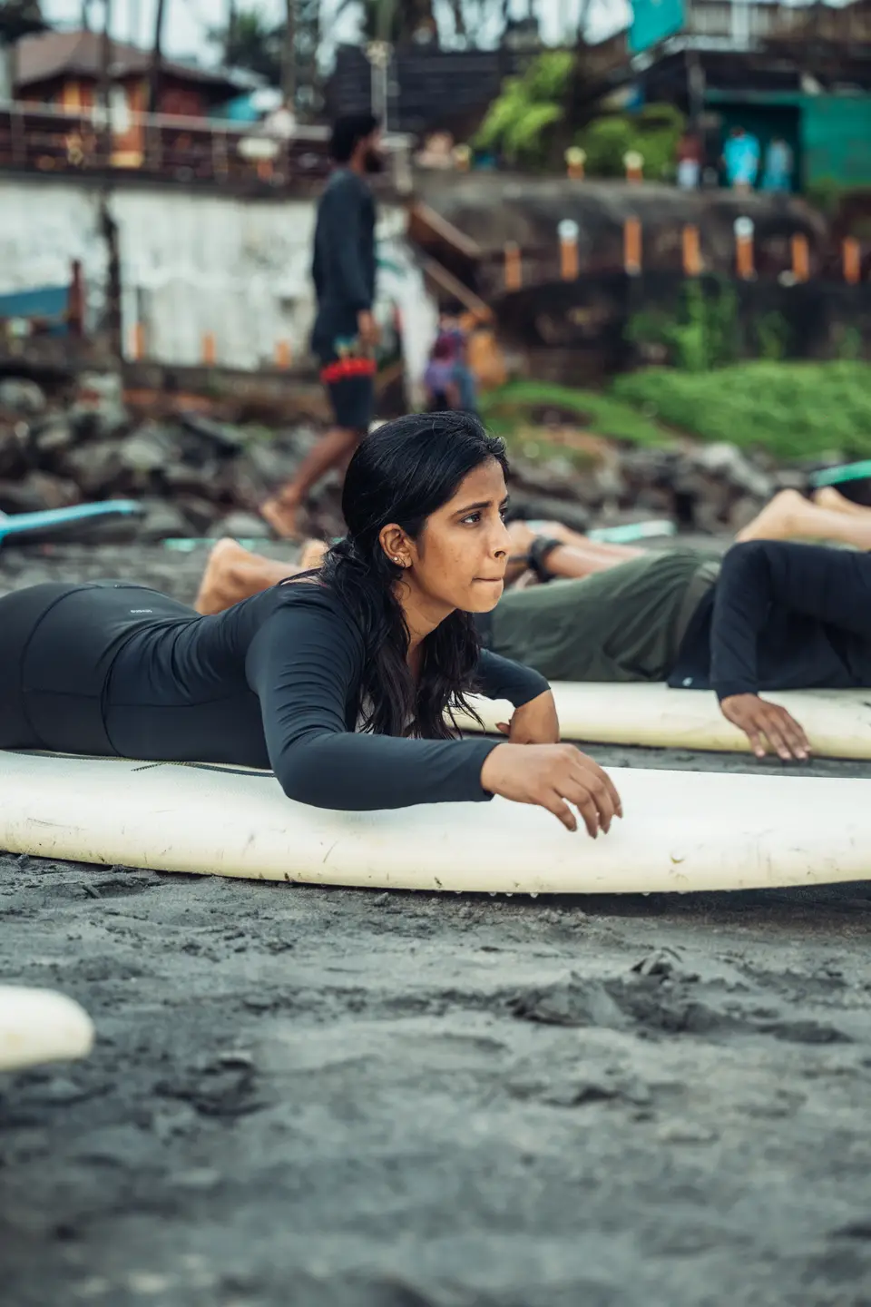 Paddle position practised on the board on the sand