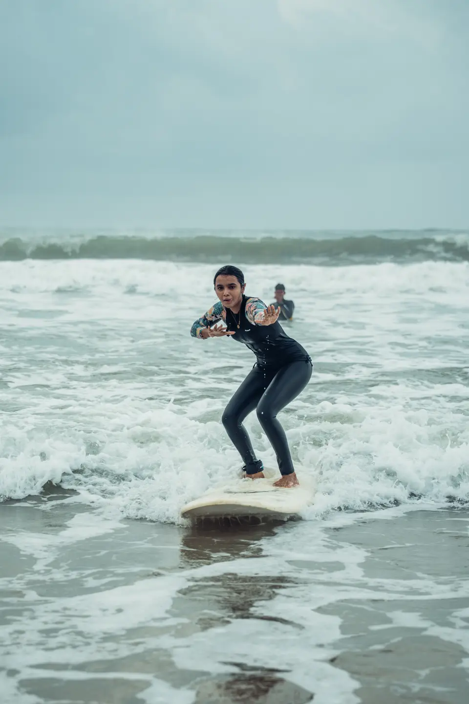 Crouched low on a cream board in the whitewash