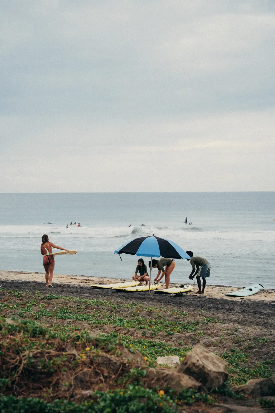 Boards down and an umbrella up, waiting out the middle of the day