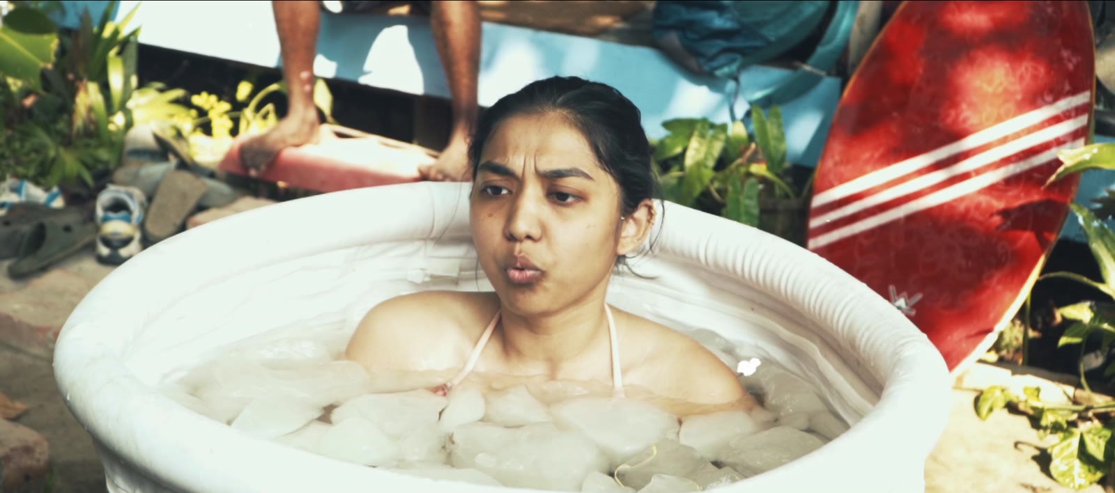 Still from the film: The ice bath at Kuma Surf House after a surf session