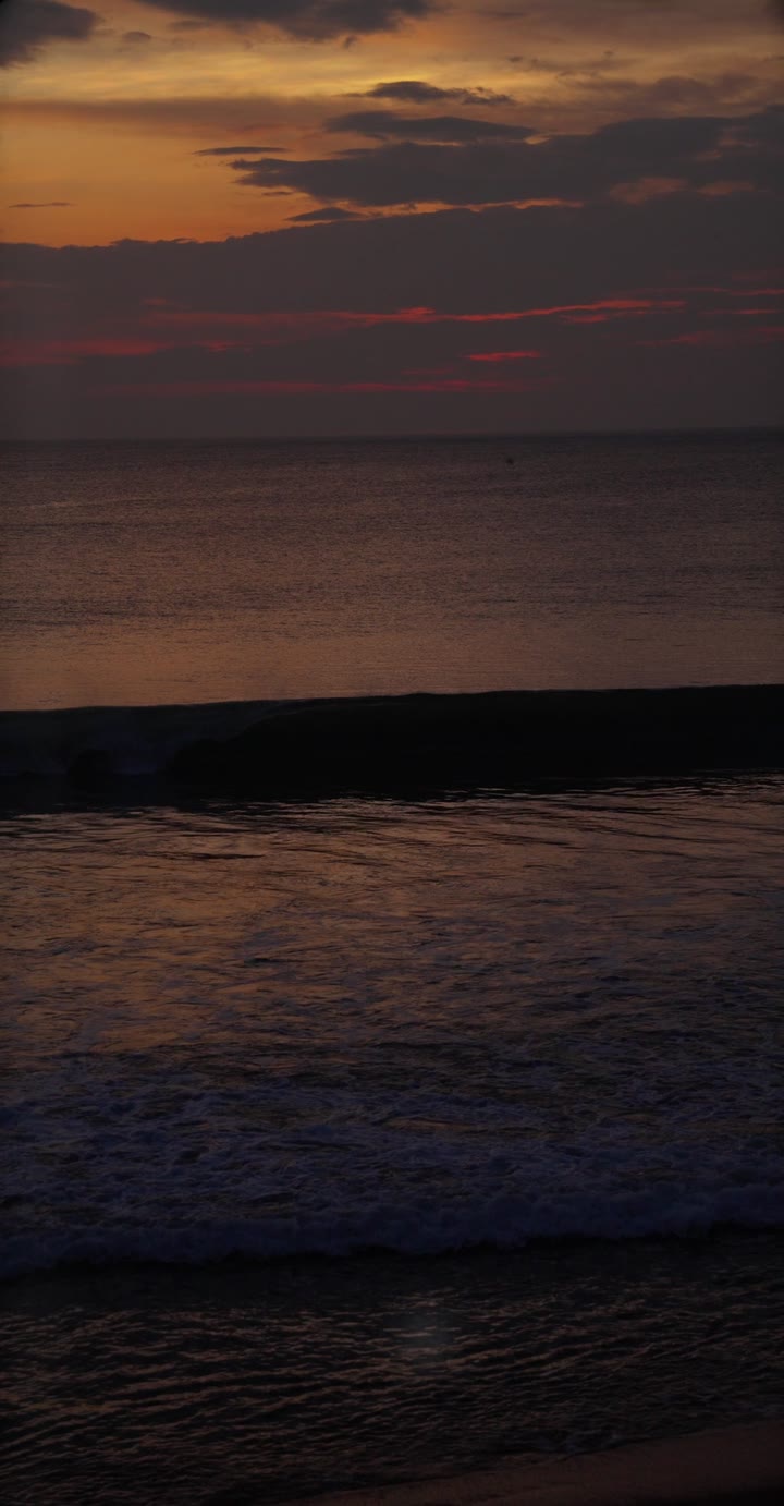 Still from the film: Sunset over the Arabian Sea near Kuma Surf House